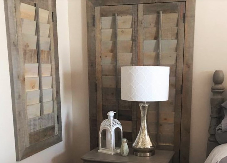 Austin bedroom with reclaimed wood shutters.